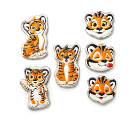 Fototapeta premium Cute cookies in shape of tiger for New Year 2022 on white background