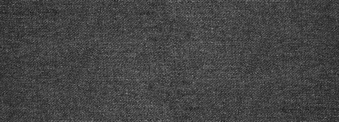 Plakat Empty black, dark, and gray abstract jeans texture, denim fabric background for banner copy space.Vintage style
