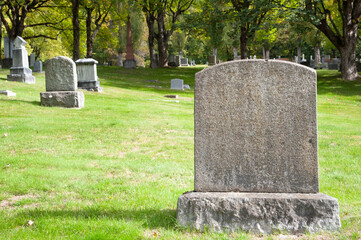 Large blank tombstone in cemetery  - obrazy, fototapety, plakaty