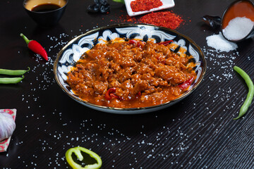 Asian food. Beef in spicy sauce with sesame seeds and chili pepper