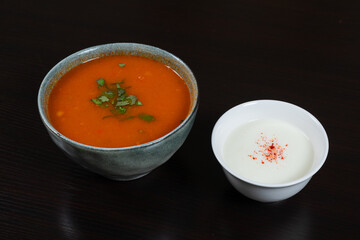 Lamb soup with rice, vegetables and cup of sour yogurt