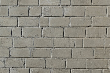 Grey brick wall textured background.