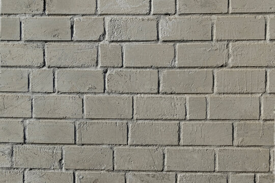 Grey brick wall textured background.