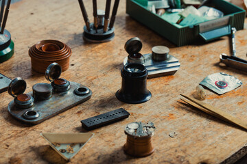 Obraz na płótnie Canvas Array of precision tools and components on a watchmakers bench