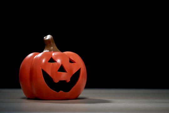 Halloween festival pumpkin Jack O lantern on wooden table