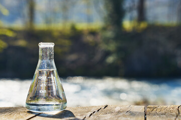 Glass flask with clean drinking water.