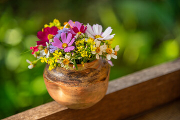 Naklejka na ściany i meble Beautiful bouquet of wildflowers in a vase