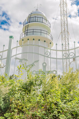 Fototapeta premium White lighthouse overlooking Hubo port on the east coast of South Korea.