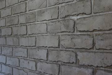 Gray wall in the form of brickwork repair and decoration of walls, taken close-up