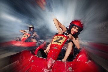 Girl is driving Go-kart with speed in Karting  - obrazy, fototapety, plakaty