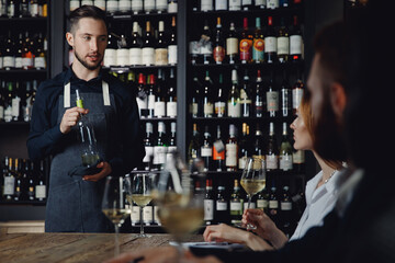 White wine tasting in restaurant with lecture from male sommelier