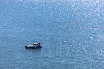 Aerial view of yacht moored in open sea.