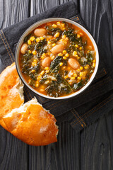 turkish soup lahana corbası Tarifi turkish soup with kale, beans and corn close-up in a bowl on the table. vertical top view from above