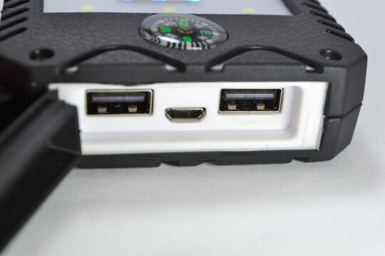 Two USB Port and Micro USB with Black Rubber cover in white  and Blurry background