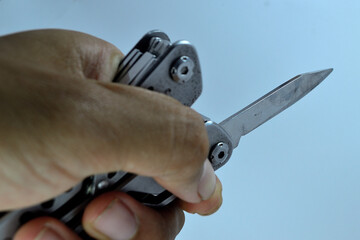 Easy-to-carry multi-function tool. Photo on a white background