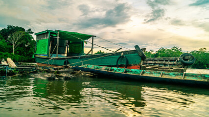 Fototapeta na wymiar Traditional wooden boat as main transportation in upper Mahakam. Wooden boat docked in Mahakam river
