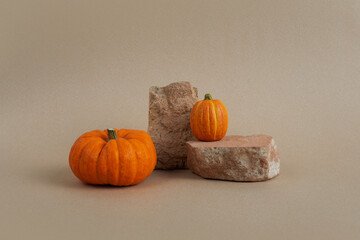 Halloween background podium display with pumpkins on biege background. Cosmetic, beauty product promotion autumn pedestal