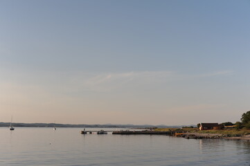 Obraz premium Pier or deck at Jomfruland island in Norway on a calm evening in summer