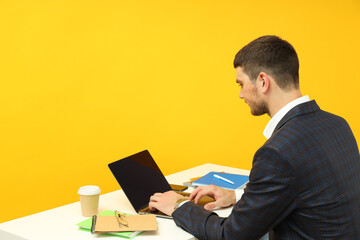 Business concept with young man working on laptop
