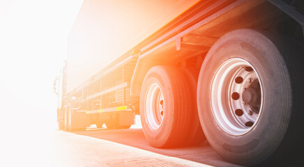 Semi Trailer Truck Parked with Sunset. Truck Wheels Tires.  Diesel Truck Cargo Freight Truck...