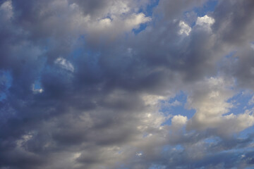 Fluffy white clouds and blue sky