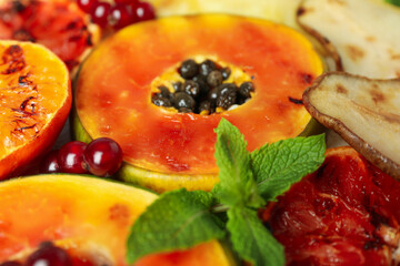Grilled fruits all over background, close up.