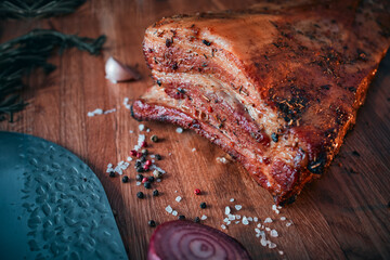 Barbecue ham, bacon, pepper, garlic. Homemade natural food. Still life with barbecue. Focus on the foreground.
