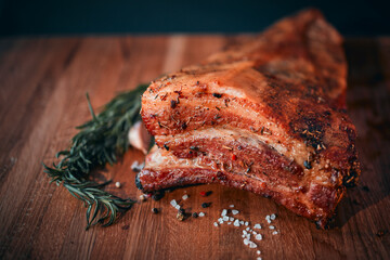 Barbecue ham, bacon, pepper, garlic. Homemade natural food. Still life with barbecue. Focus on the foreground.