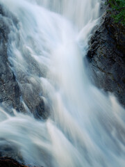 Closeup of a waterfall in the alps in summer