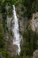Fototapeta na wymiar High waterfall near Matrei in Osttirol in summer