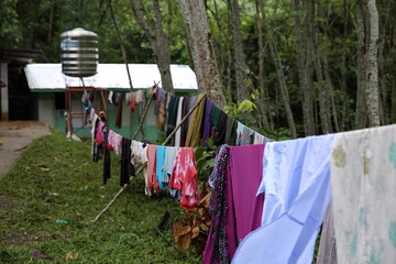 washed colorful cloths handed on the rope outside in marawi city, mindanao island