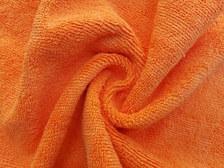 Swirling orange microfiber cloth background