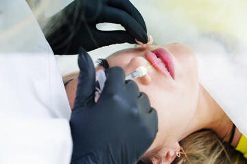 Injections of the lips. Adjustment of the lower lip form. Injection of beauty. Spa. Facial...
