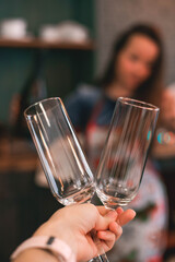 Close-up of two champagne glasses in hand
