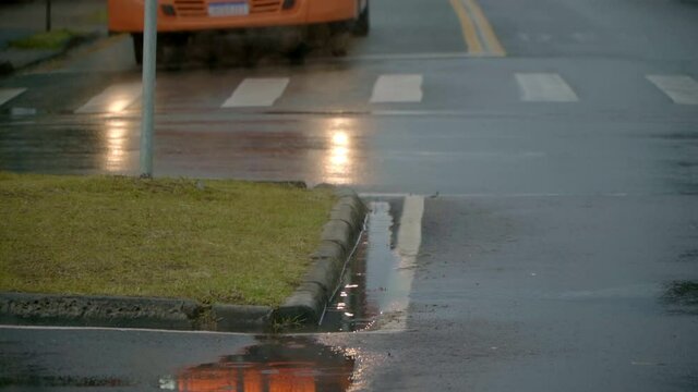 from a car window on a rainy day in Curitiba Brazil where landscapes of the city are seen through the car window with rain on the windows
