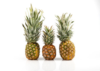 Three beautiful pineapples on white background
