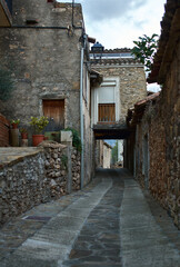 Stone alley in an old town surrounded by stone walls