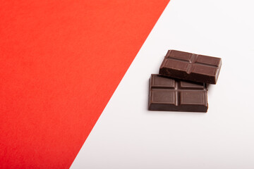 Chocolate on white and red background