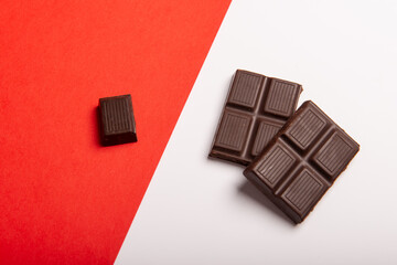 Chocolate on white and red background