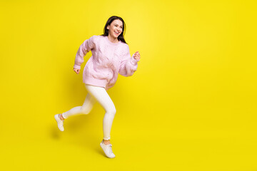 Full body profile photo of impressed millennial lady run wear sweater pants isolated on yellow color background