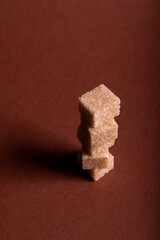 Cube sugar on brown background