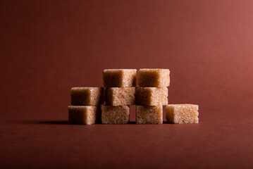 Cube sugar on brown background