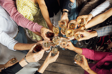 People hold in hands glasses with white wine. wedding party.