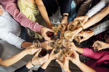 Fototapeta premium People hold in hands glasses with white wine. wedding party.