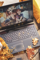 Halloween online virtual holiday remote celebration halloween in lockdown garden quarantine covid new normal, social distance, remote communication,stay home vocation halloween selective focus