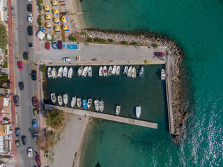 Aerial top down view of ipsos beach in Greece. . Beautiful torquoise water and beach with umbrellas