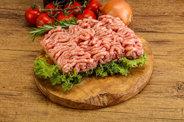 Raw pork minced meat over board