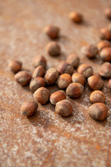 Lot of hazelnuts on rustic plate