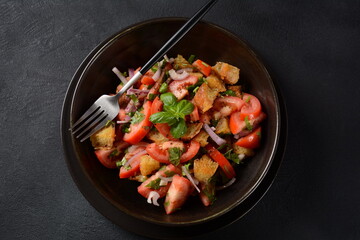 Panzanella, traditional Italian salad with tomatoes and bread. Tuscan , Mediterranean healthy food.