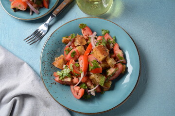 Panzanella, traditional Italian salad with tomatoes and bread. Tuscan , Mediterranean healthy food.